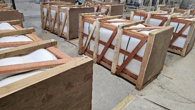 Export packaging team workers securing granite crates professional handling India